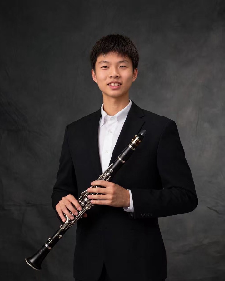 Willis Hongyuan Liu holding a clarinet
